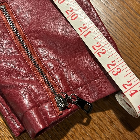 New perfect condition red faux leather jacket. Adorned with zippers and snaps. - Picture 8 of 8